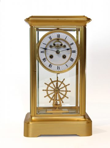four-glass-clock-ships-wheel-pendulum