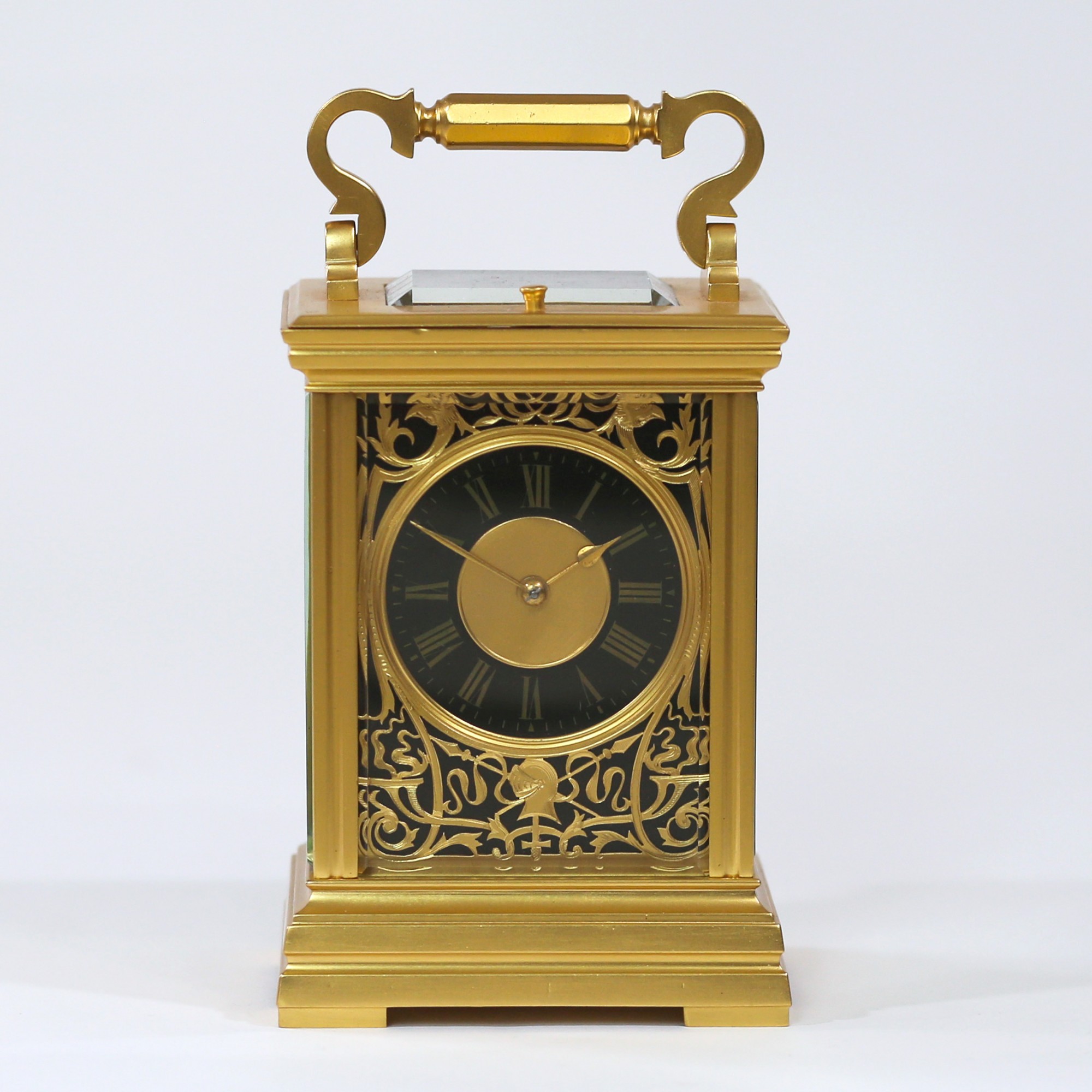 Gilt Repeating Carriage clock with Medieval theme Mask - Carlton Clocks